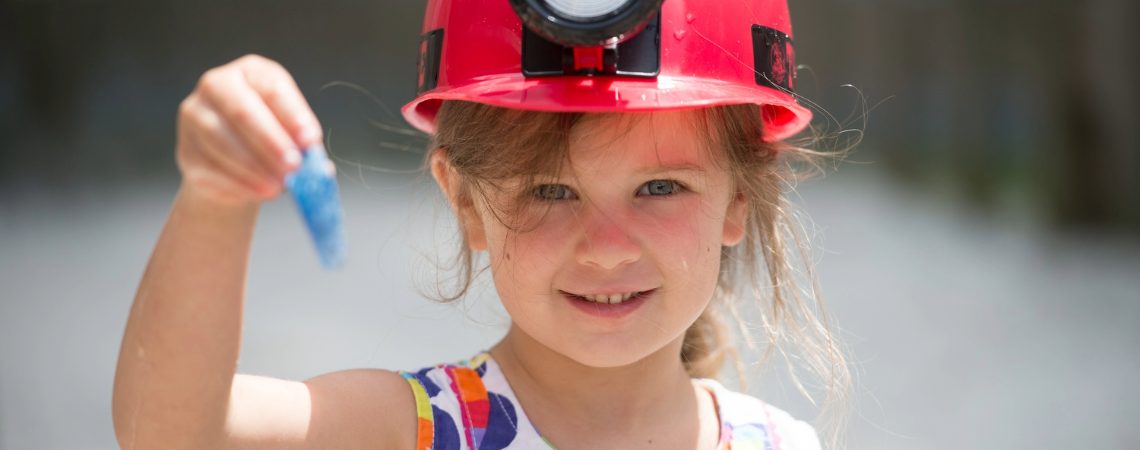 Young girl discovers gems while gem mining at Tweetsie Railroad.