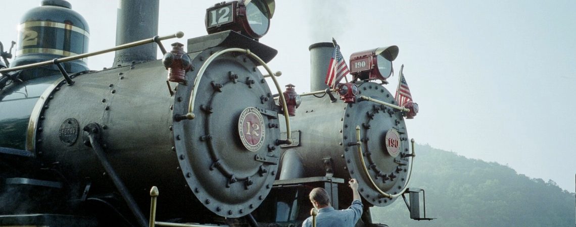 Historic steam locomotives No. 12 and No. 190 stand side by side at Tweetsie Railroad.